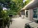 Spacious outdoor deck with a grill and seating, surrounded by lush greenery at 9190 Hastings Trce, Indianapolis, IN 46234