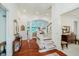 Grand foyer featuring hardwood floors, staircase, and views into the formal living spaces at 9190 Hastings Trce, Indianapolis, IN 46234