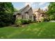Charming brick home with manicured lawn and mature trees, creating a serene and inviting curb appeal at 9190 Hastings Trce, Indianapolis, IN 46234