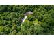 Aerial view of the house nestled among lush greenery, featuring a long driveway and a well-maintained lawn at 9722 N Gasburg Rd, Mooresville, IN 46158