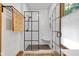 Modern shower with black framed glass, white subway tile surround, and bench seating at 9722 N Gasburg Rd, Mooresville, IN 46158