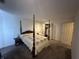 Bedroom with a four-poster bed and carpet at 1001 Paradise Ct # F, Greenwood, IN 46143