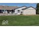 This property boasts a well-maintained lawn and unique stone features at 1001 Paradise Ct # F, Greenwood, IN 46143