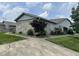 A charming exterior with stone accents, lush landscaping, and a well-maintained lawn at 1001 Paradise Ct # F, Greenwood, IN 46143