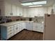 Bright kitchen with white cabinets and light countertop at 1001 Paradise Ct # F, Greenwood, IN 46143