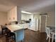Kitchen with white cabinets, bar, and appliances at 1001 Paradise Ct # F, Greenwood, IN 46143