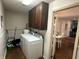 Laundry room with washer, dryer, and storage cabinets at 1001 Paradise Ct # F, Greenwood, IN 46143