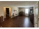 Living room featuring hardwood floors and natural light from the window at 1001 Paradise Ct # F, Greenwood, IN 46143