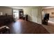 A living room features laminate flooring, a vintage desk, and a cozy ambiance at 1001 Paradise Ct # F, Greenwood, IN 46143