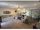 Open living room, with comfortable seating, flowing to the kitchen and dining area at 1001 Paradise Ct # F, Greenwood, IN 46143