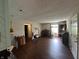 A spacious living room showcasing laminate flooring and abundant natural light at 1001 Paradise Ct # F, Greenwood, IN 46143