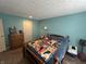 A comfy bedroom with a bed and dresser, providing a tranquil retreat at 1001 Paradise Ct # F, Greenwood, IN 46143