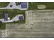 Overhead view of farmhouse and modern barn surrounded by fields and greenery at 10769 Shelbyville Rd, Indianapolis, IN 46259