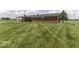 Expansive backyard with a covered patio, ideal for outdoor entertaining and relaxation in a serene setting at 10769 Shelbyville Rd, Indianapolis, IN 46259