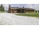 The home features a large backyard with a covered patio, perfect for outdoor entertaining and relaxing at 10769 Shelbyville Rd, Indianapolis, IN 46259