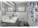Modern bathroom featuring a sleek vanity and a shower-tub combination, creating a relaxing and functional space at 10769 Shelbyville Rd, Indianapolis, IN 46259