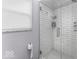 Modern bathroom featuring a glass shower with subway tile and penny tile floor at 10769 Shelbyville Rd, Indianapolis, IN 46259