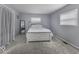 Neutral bedroom with carpet flooring, white bed frame, and bright window at 10769 Shelbyville Rd, Indianapolis, IN 46259