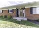 Charming brick home with a welcoming front entrance and manicured lawn at 10769 Shelbyville Rd, Indianapolis, IN 46259