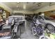 Spacious garage filled with cars, bikes, and tools, offering ample storage space at 10769 Shelbyville Rd, Indianapolis, IN 46259