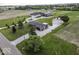 Aerial view of a home featuring a long driveway, large yard, and outbuilding at 10769 Shelbyville Rd, Indianapolis, IN 46259