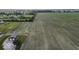 Expansive farmland featuring newly planted crops under a picturesque sky at 10769 Shelbyville Rd, Indianapolis, IN 46259