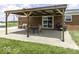 The patio features a covered patio with a table and chairs, perfect for enjoying the outdoors and relaxing at 10769 Shelbyville Rd, Indianapolis, IN 46259