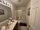 Bathroom with single sink, tile flooring, bathtub with shower and commode at 10780 Affirmed Dr, Indianapolis, IN 46234