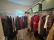 Walk-in closet showing clothing hung from a wire rack at 10780 Affirmed Dr, Indianapolis, IN 46234
