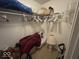 Walk-in closet with wire shelving holding various household goods and cleaning equipment at 10780 Affirmed Dr, Indianapolis, IN 46234