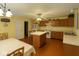 Bright eat-in kitchen with wooden cabinets, tile flooring, central island and modern white appliances at 10780 Affirmed Dr, Indianapolis, IN 46234