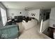 Bright living room with a large picture window, comfortable seating, and an entertainment center at 10780 Affirmed Dr, Indianapolis, IN 46234