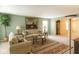 Inviting living room with large windows, comfortable sofas, and neutral decor at 10780 Affirmed Dr, Indianapolis, IN 46234