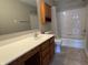 Well-maintained bathroom with a vanity and a shower-tub combination at 10891 Sweetsen Rd, Camby, IN 46113