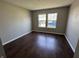 A bright bedroom featuring hardwood floors and a pair of windows at 10891 Sweetsen Rd, Camby, IN 46113
