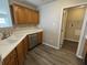 A bright kitchen featuring stainless steel appliances and dark wood cabinets at 10891 Sweetsen Rd, Camby, IN 46113