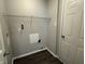 An indoor laundry area including utility connections, shelving, and convenient access at 10891 Sweetsen Rd, Camby, IN 46113