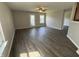Spacious living room with modern flooring and ample natural light, creating a comfortable and inviting atmosphere at 10891 Sweetsen Rd, Camby, IN 46113
