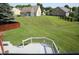 Spacious backyard with lush green lawn and wood fence at 10949 Haig Point Dr, Fishers, IN 46037