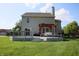 Lush backyard with a spacious deck, pergola, and plenty of room for outdoor activities at 10949 Haig Point Dr, Fishers, IN 46037