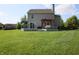 Spacious backyard featuring a wooden deck, pergola and ample green space at 10949 Haig Point Dr, Fishers, IN 46037
