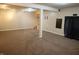 Finished basement with carpet, a support beam, and curtain at 10949 Haig Point Dr, Fishers, IN 46037