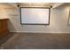 Finished basement features plush carpeting and a large projector screen at 10949 Haig Point Dr, Fishers, IN 46037