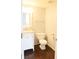 Small bathroom with tile flooring, toilet, sink, mirror, and towel rack at 10949 Haig Point Dr, Fishers, IN 46037