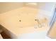 Large bathtub with jets, faucets, and shower at 10949 Haig Point Dr, Fishers, IN 46037