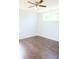 Bedroom featuring hardwood floors and natural light from two windows at 10949 Haig Point Dr, Fishers, IN 46037