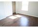 Bedroom featuring beautiful hardwood floors and a closet at 10949 Haig Point Dr, Fishers, IN 46037