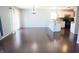 Spacious dining area next to the kitchen with hardwood floors and a modern chandelier at 10949 Haig Point Dr, Fishers, IN 46037