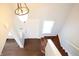 Bright entryway featuring a chandelier and hardwood floors at 10949 Haig Point Dr, Fishers, IN 46037