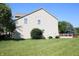 Rear exterior view showcasing the home's siding and well-maintained lawn at 10949 Haig Point Dr, Fishers, IN 46037
